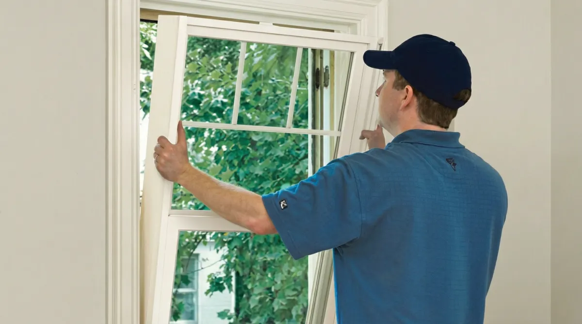 Professional contractors performing a residential window insulation and replacement service in Chandler, AZ